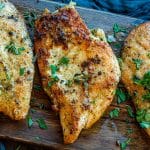 herb crusted chicken garnished with fresh herbs