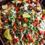 loaded taco fries on a baking sheet