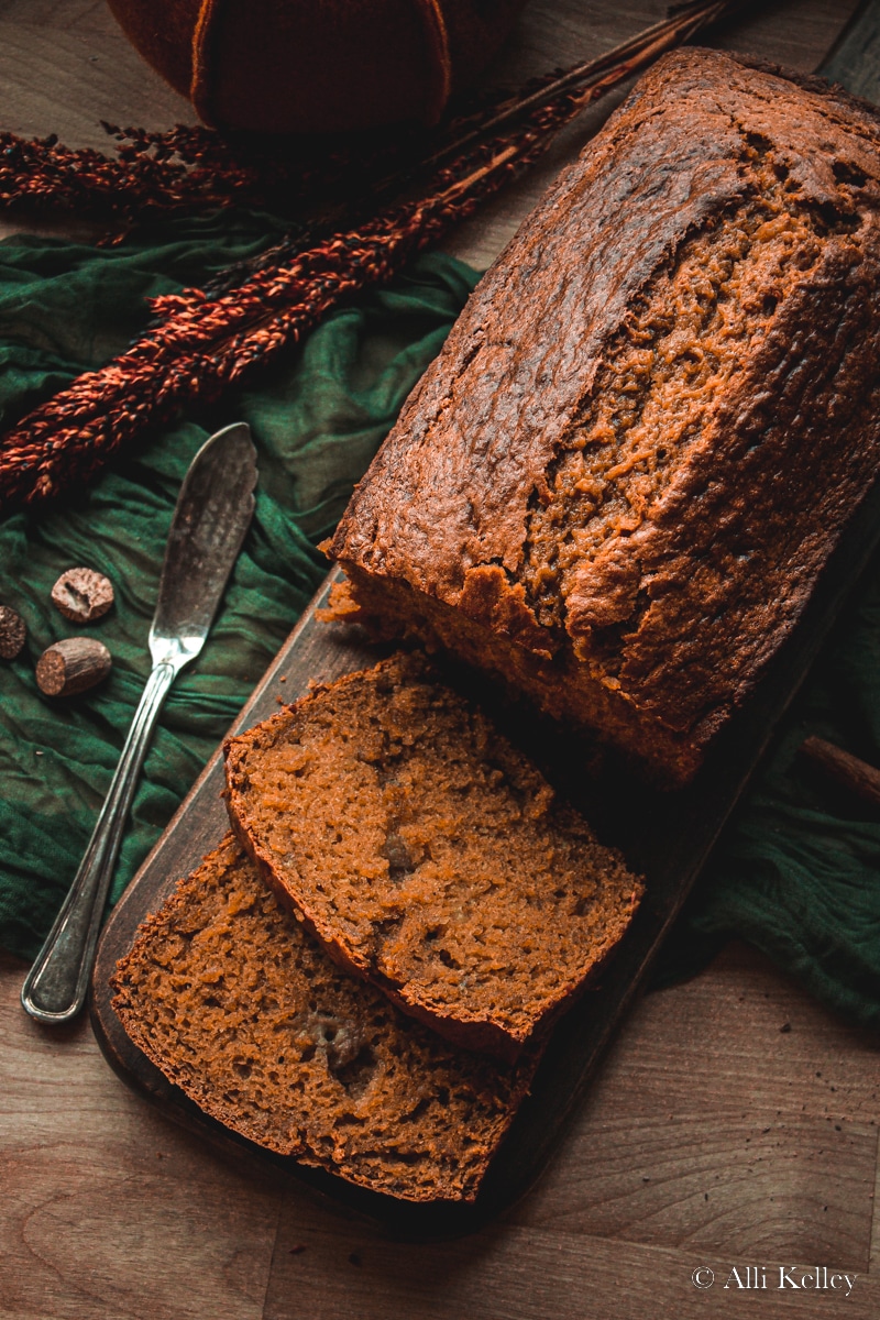 banana pumpkin bread with two pieces sliced off.