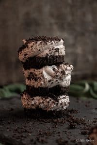 stacked oreo cheesecake bites topped with crushed oreos